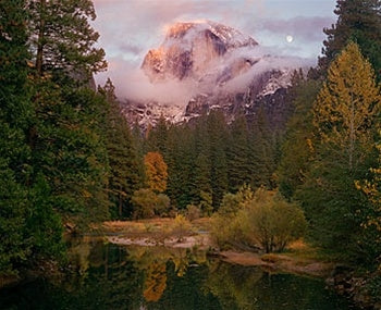 a view of a mountain in the distance in a field 